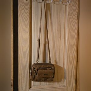 Small darker tan crossbody purse
